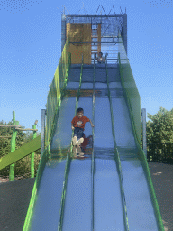 Max on a slide at the playground near Restaurant Smulrijk at the Dierenrijk zoo