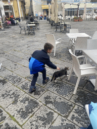 Max with a cat at the Piazza Umberto I square