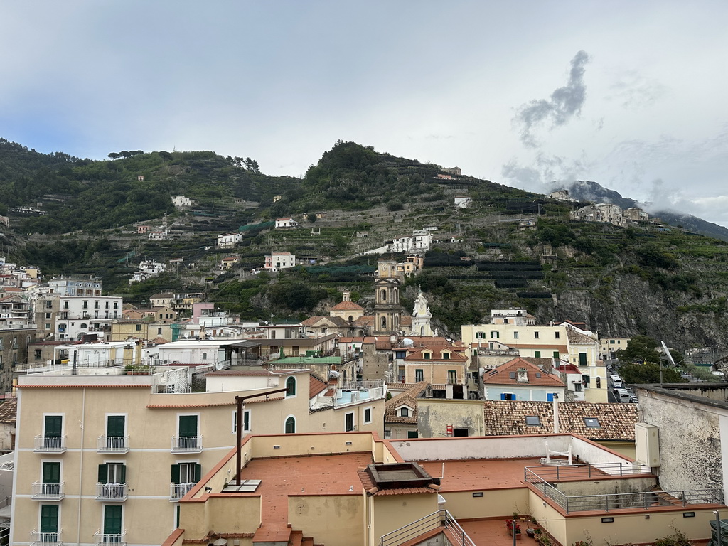 Rooftops, the tower of the Basilica di Santa Trofimena church and buildings at the town center, viewed from the Via Caruseillo street