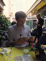 Tim with travel guide in our lunch restaurant in the Rue Émile de Loth street