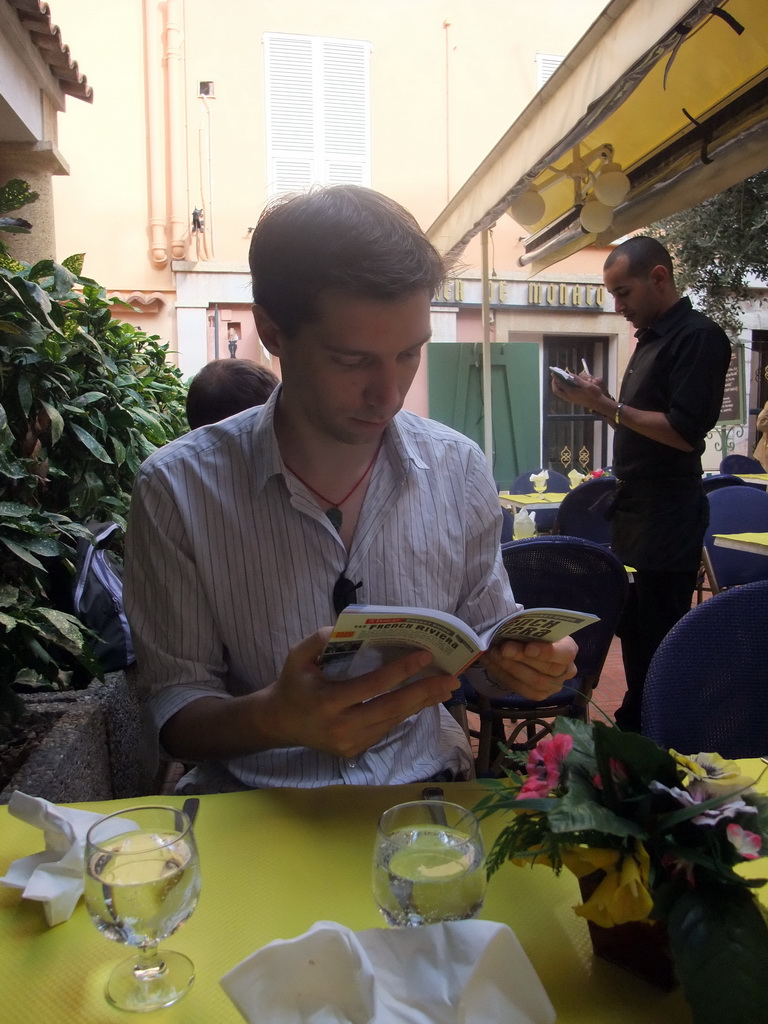 Tim with travel guide in our lunch restaurant in the Rue Émile de Loth street