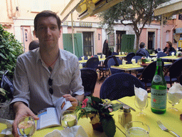 Tim with travel guide in our lunch restaurant in the Rue Émile de Loth street