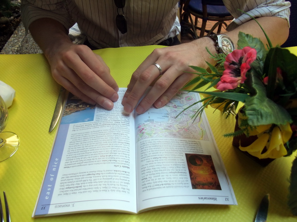 Tim with travel guide in our lunch restaurant in the Rue Émile de Loth street