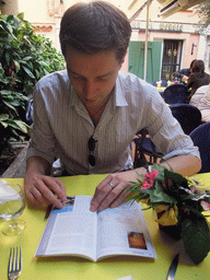 Tim with travel guide in our lunch restaurant in the Rue Émile de Loth street