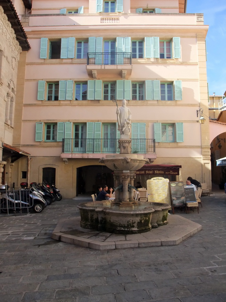 Fountain with statue of Saint Nicholas, at the Rue de l`Église street