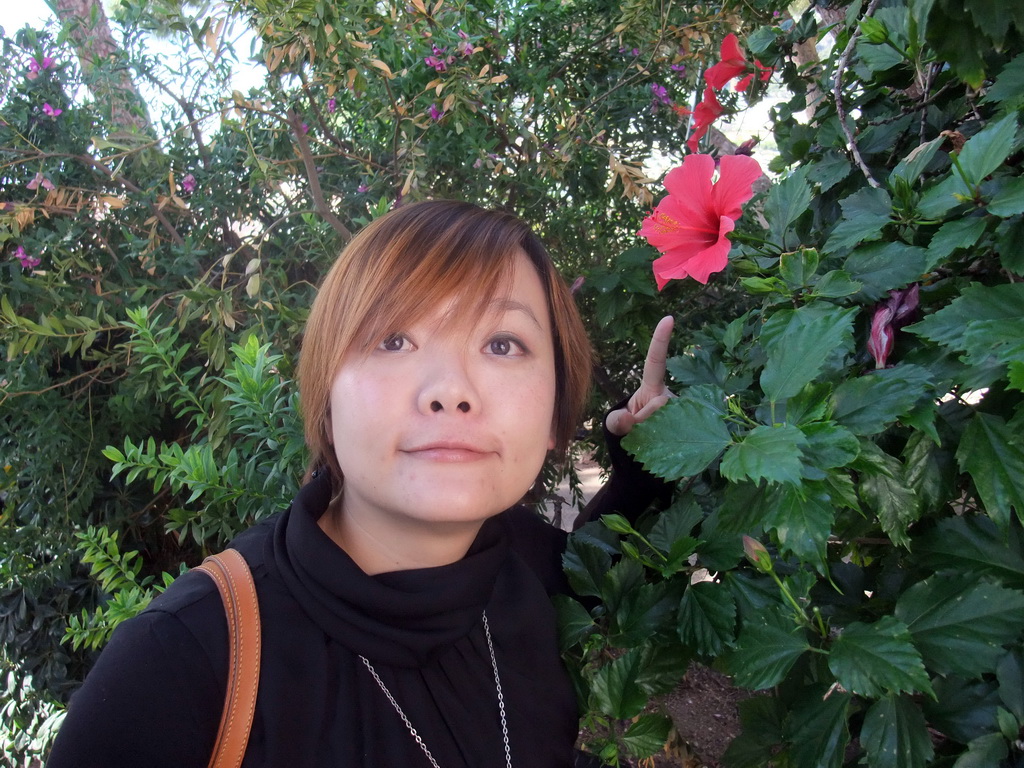 Miaomiao with flowers at the Ruelle Sainte-Barbe alley