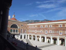 The northwest side of the Main Courtyard, the marble staircase and the Palatine chapel at the Prince`s Palace of Monaco