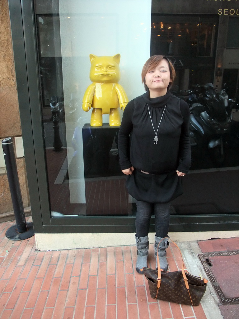 Miaomiao with a statue of a cat