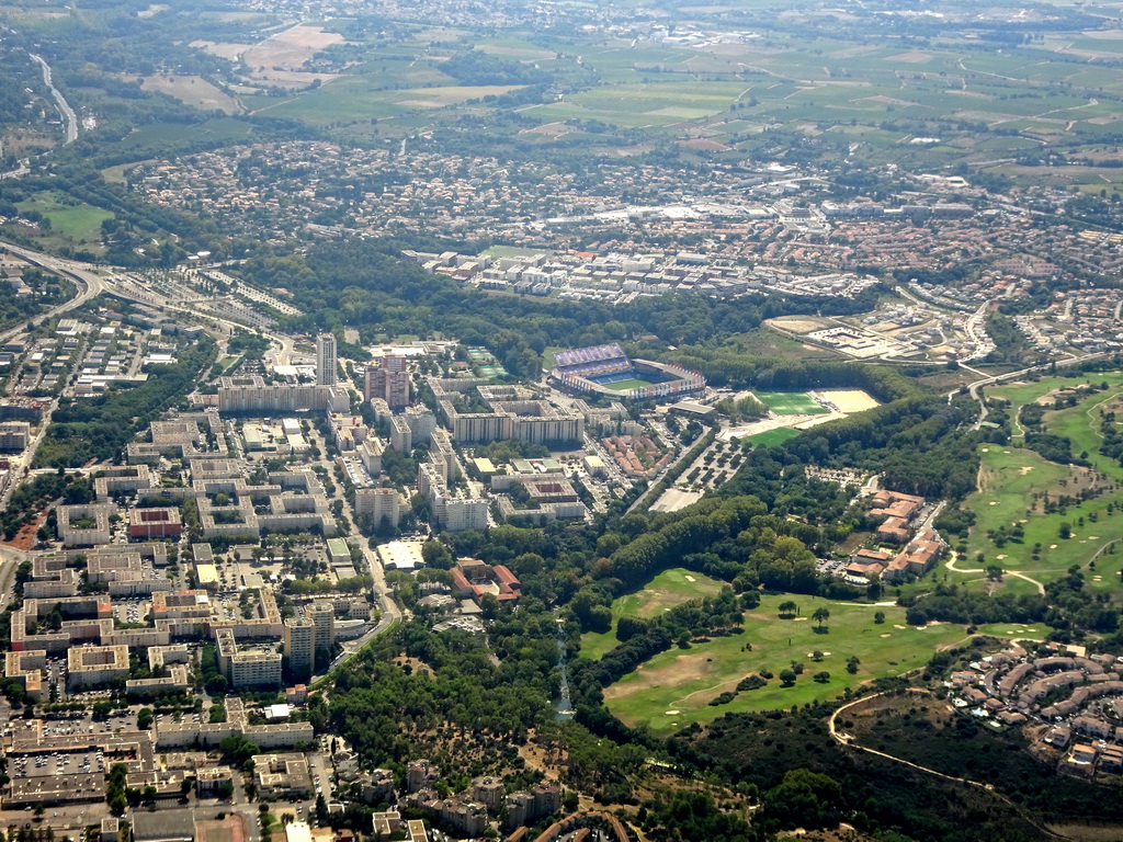 The west side of the city with the Stade de la Mosson stadium and the Golf Resort Montpellier Fontcaude, viewed from the airplane from Amsterdam