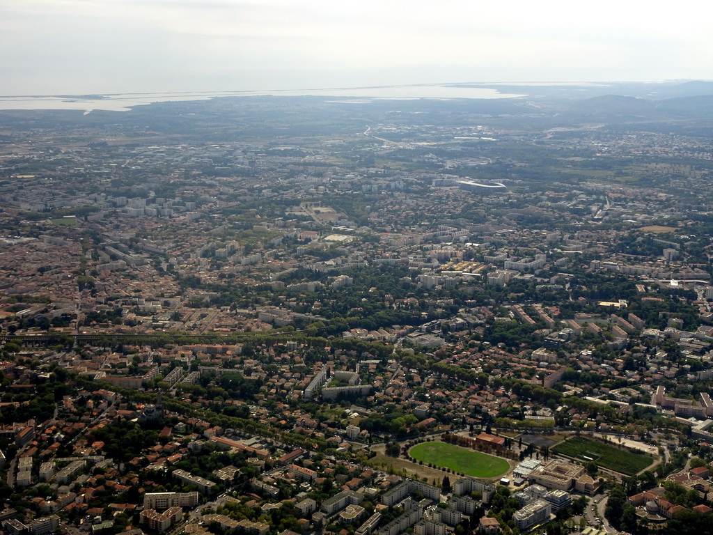 The southwest side of the city with the Parc Montcalm, the Altrad Stadium and the mediterranean coast, viewed from the airplane from Amsterdam