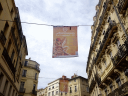 Banner of the Arabesque festival above the Rue de la Loge street