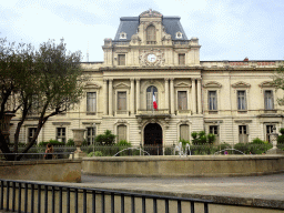 Fountain at the Esplanade Léo Mallet square and the front of the Préfecture de l`Hérault building