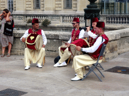Street musicians at the back side of the Porte du Peyrou arch at the Rue Foch street