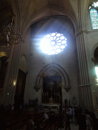 Left transept with rose window, altar and painting `Christ handing Saint Peter the keys of the kingdom of heaven` by Antoine Ranc and Jean Charmeton at the Montpellier Cathedral