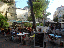 Terraces and the north side of the Église Saint Roch church at the Rue des Surs Noires street