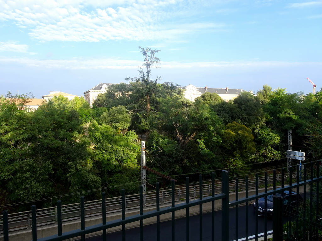 The Allée de la Citadelle street, the railway and the front of the Lycée Joffre school, viewed from the Esplanade Charles-de-Gaulle park