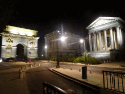 The Rue Foch street with the front of the Porte du Peyrou arch and the Palace of Justice, by night