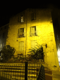 Front of a house at the Place du Château square, by night