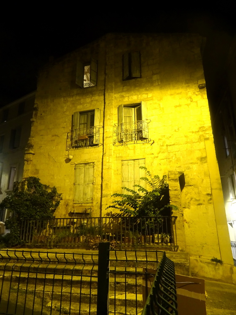 Front of a house at the Place du Château square, by night