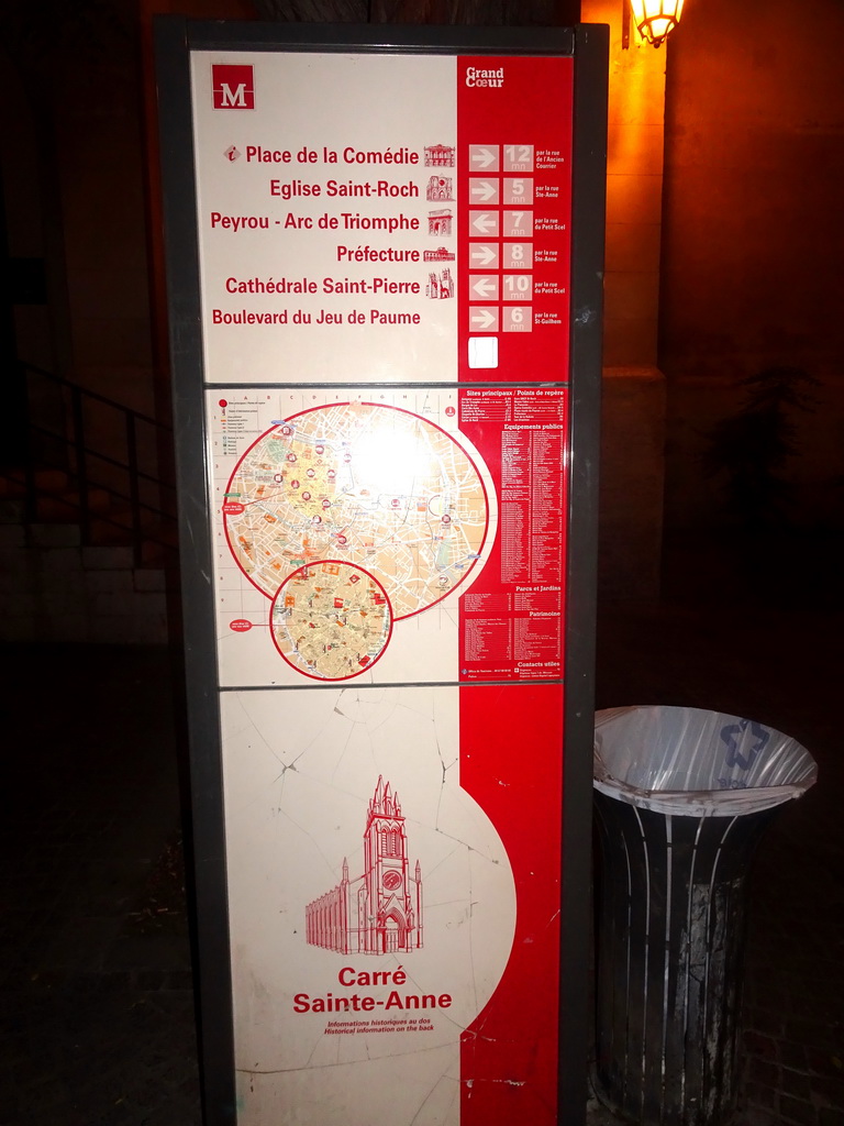 Signpost with map at the Place Sainte-Anne square, by night