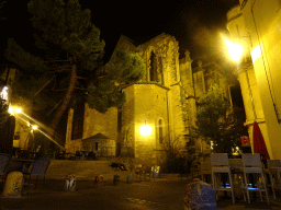 The Rue Saint-Paul street and the northwest side of the Église Saint Roch church, by night