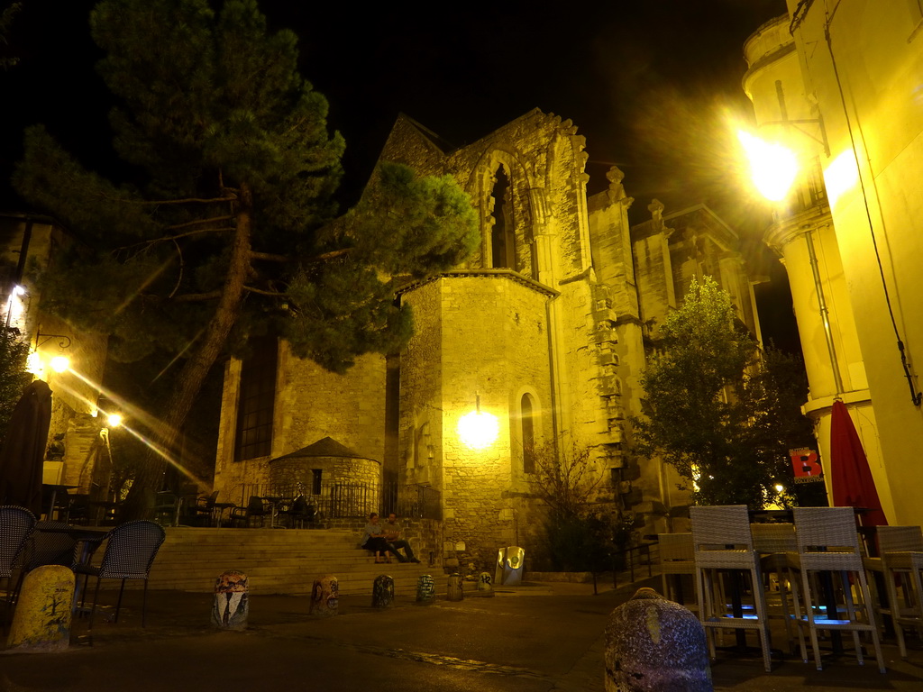 The Rue Saint-Paul street and the northwest side of the Église Saint Roch church, by night