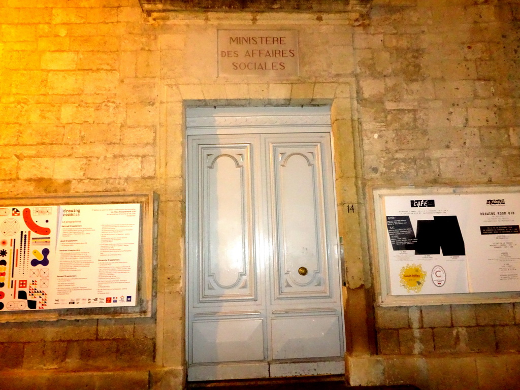 Gate to the La Panacée art center at the Rue de l`École de Pharmacie street, by night