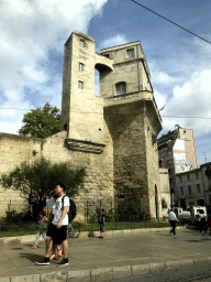 The front of the Tour de la Babote tower at the Place Alexandre Laissac square, viewed from the taxi to the airport