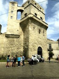 The front of the Tour de la Babote tower at the Place Alexandre Laissac square, viewed from the taxi to the airport