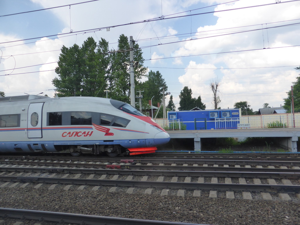 Train at the train platform of Vishnyi Volochek Railway Station, viewed from the high speed train from Saint Petersburg