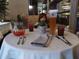 Miaomiao with sangria and a Paulaner beer at a restaurant at the Zubovsky boulevard