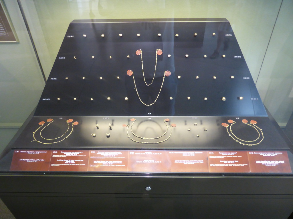 Jewelry, part of Priam`s Treasure, at Room 3: Ancient Troy and Schliemann`s excavations at the Ground Floor of the Pushkin Museum of Fine Arts, with explanation