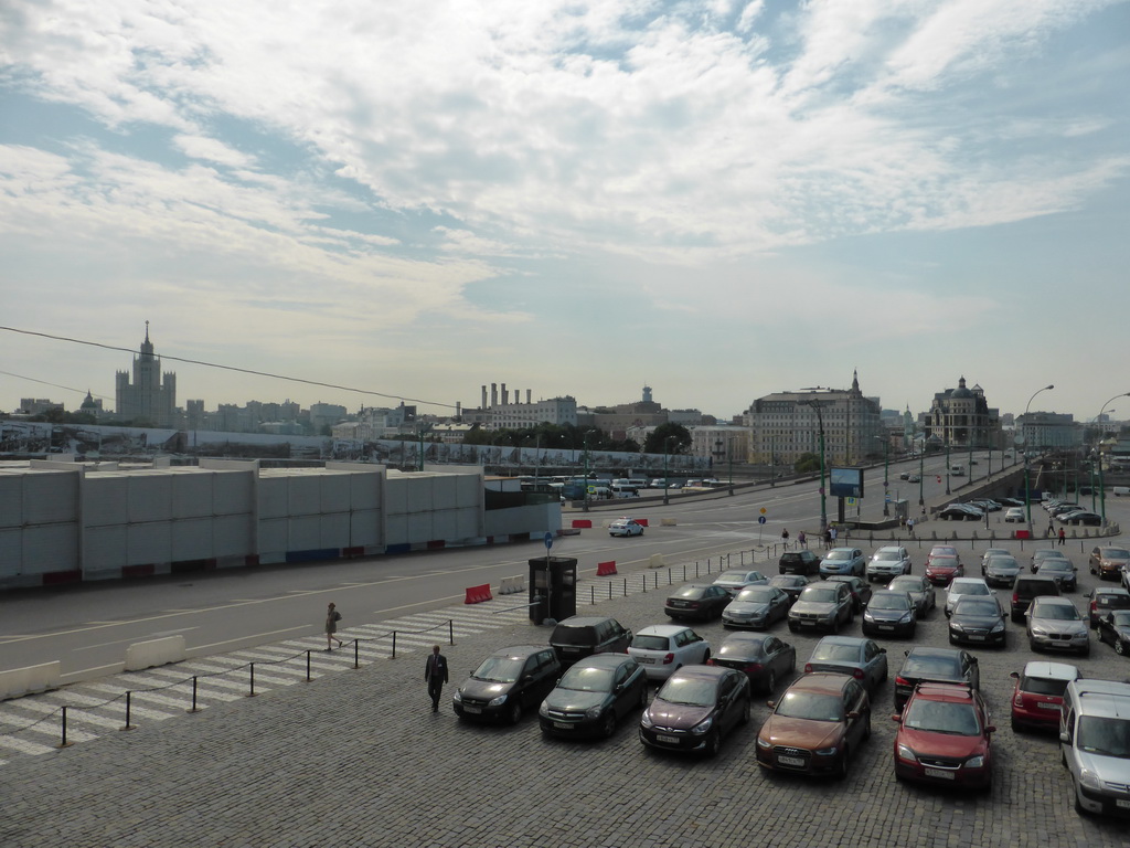 Parking place at the back side of Saint Basil`s Cathedral, the Kotelnicheskaya Embankment Building and the Bolshoy Moskvoretsky bridge over the Moskva river