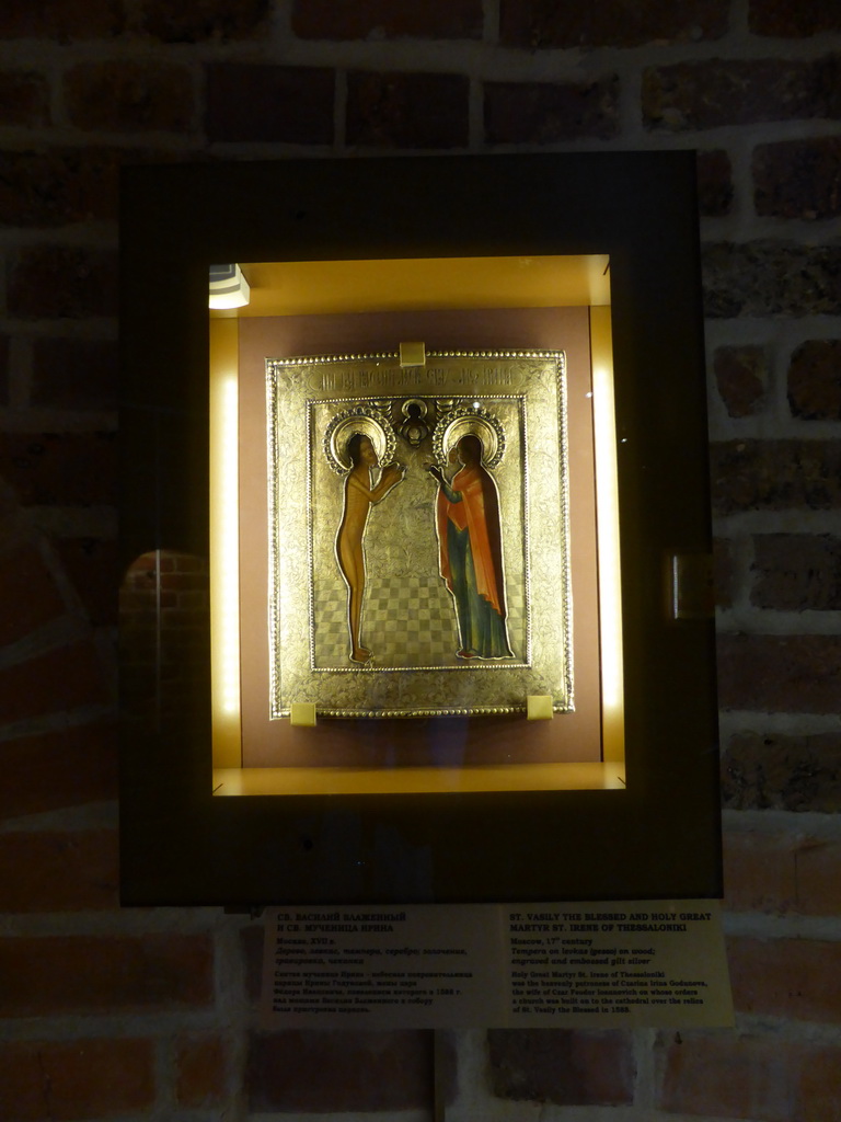 Piece of art `St. Vasily the Blessed and Holy Great Martyr St. Irene of Thessaloniki`, with explanation, at the Basement of Saint Basil`s Cathedral