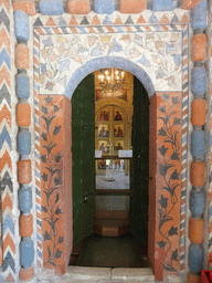 Door decorated with frescoes leading to the Church of St. Nicholas Velikoretsky at the First Floor of Saint Basil`s Cathedral