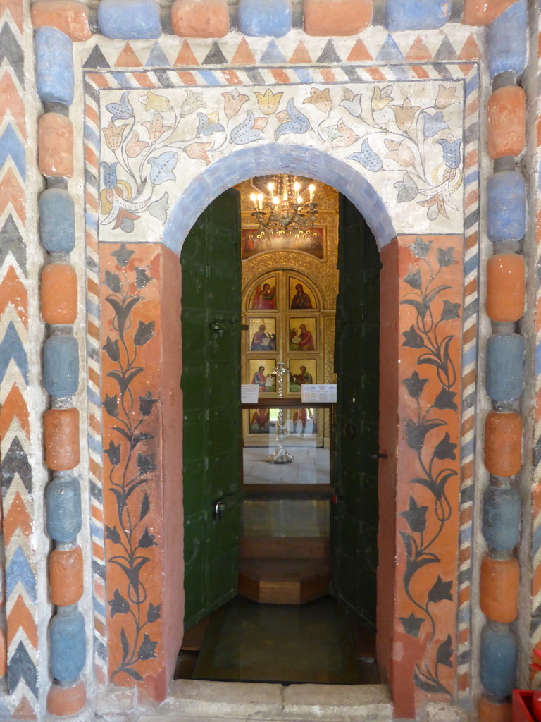 Door decorated with frescoes leading to the Church of St. Nicholas Velikoretsky at the First Floor of Saint Basil`s Cathedral