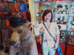 Miaomiao with a stuffed bear in a shop at the GUM shopping center