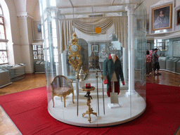 Clock, chair, clothing and other items in Room 23: Russia under the Successors of Peter the Great, at the Second Floor of the State Historical Museum of Russia