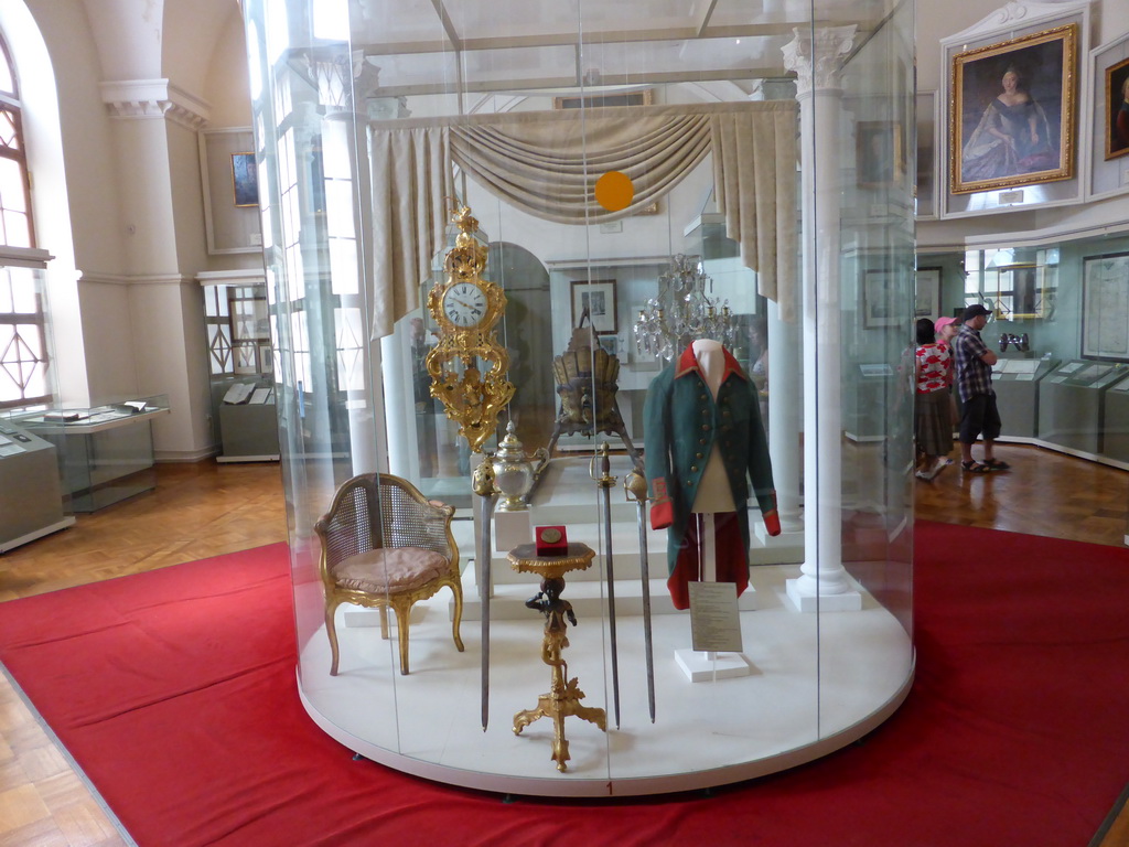 Clock, chair, clothing and other items in Room 23: Russia under the Successors of Peter the Great, at the Second Floor of the State Historical Museum of Russia