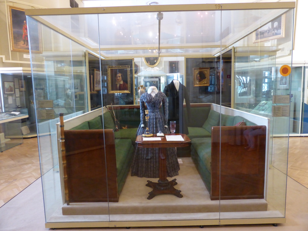 Room 36: Russia in the Epoch of Emperor Nicholas I, the Autocracy and Society, with sofa, table, traditional clothing and paintings, at the Second Floor of the State Historical Museum of Russia
