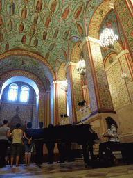 Pianist and choir at the Front Hall with the genealogic tree of Russian rulers on the ceiling, at the Ground Floor of the State Historical Museum of Russia