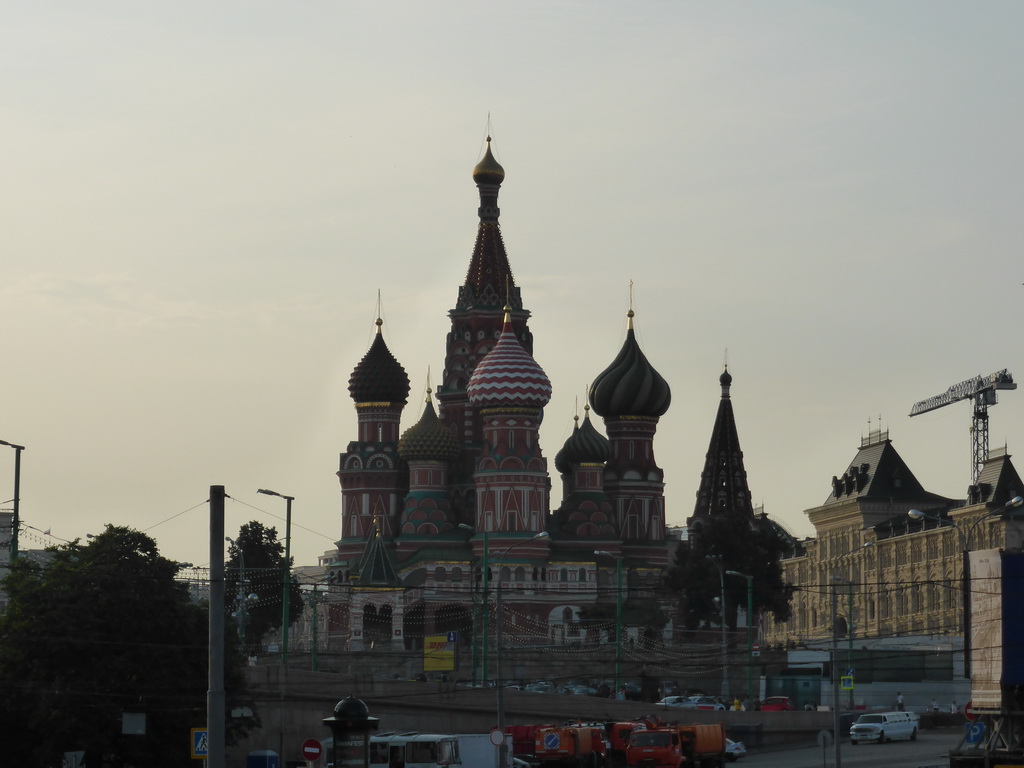 Saint Basil`s Cathedral and the GUM shopping center at the Red Square, viewed from the tour boat on the Moskva river