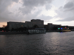 The Main Command of the Ground Forces of the Russian Federation building and boats in the Moskva river, viewed from the tour boat, at sunset