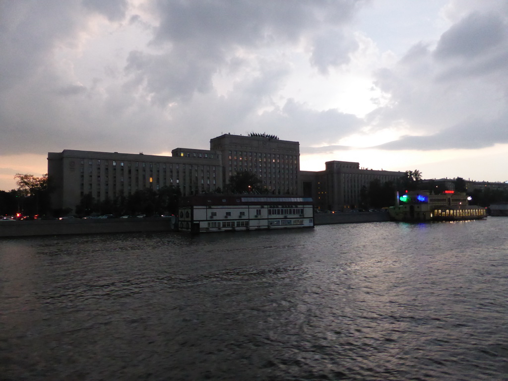 The Main Command of the Ground Forces of the Russian Federation building and boats in the Moskva river, viewed from the tour boat, at sunset