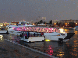 Our tour boat in the Moskva river at the dock near Krymsky Bridge, and the Main Command of the Ground Forces of the Russian Federation building, at sunset