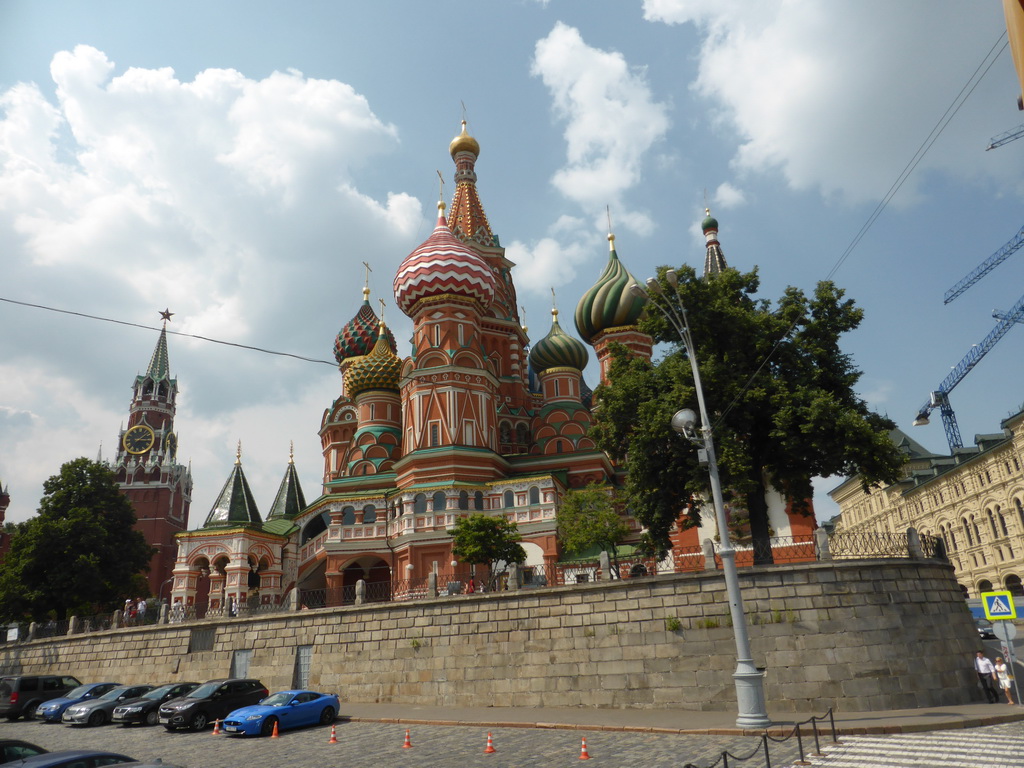 The back side of Saint Basil`s Cathedral and the Spasskaya Tower at the Moscow Kremlin, viewed from the sightseeing bus at Vasilyevskiy Spusk Square