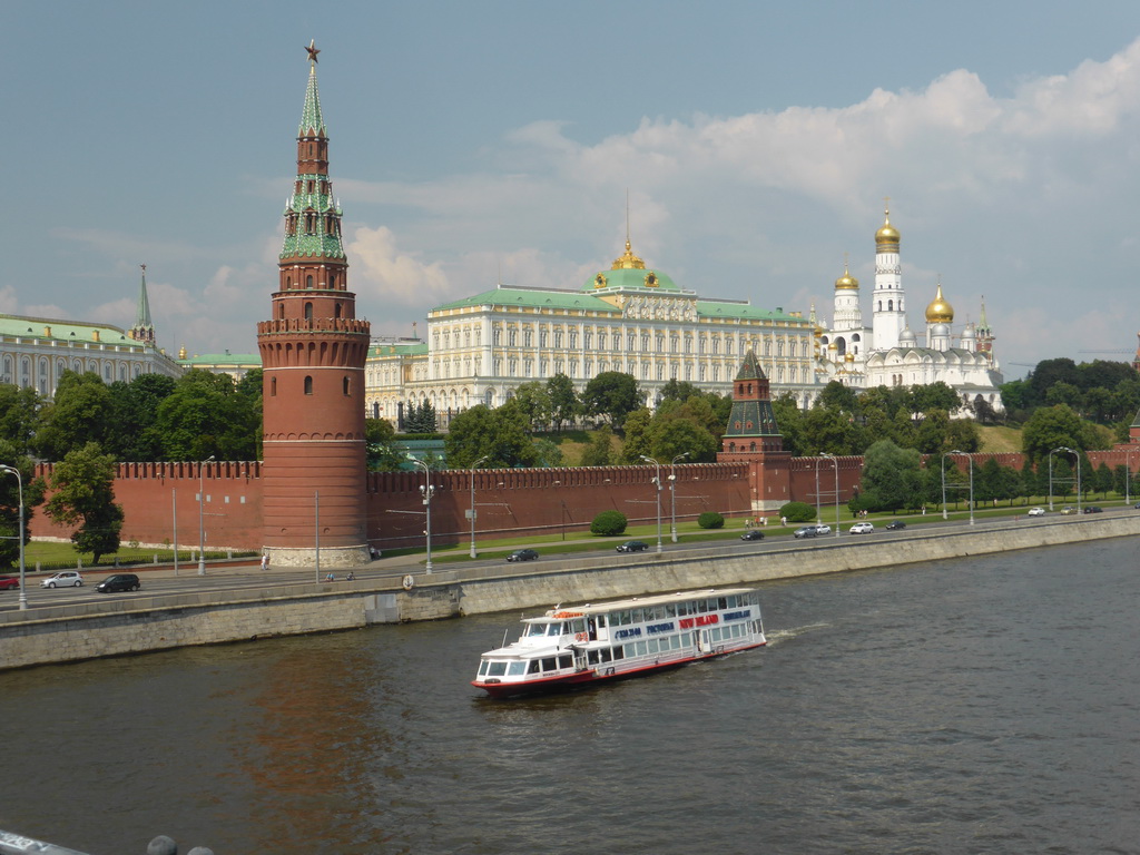 The Moscow Kremlin with the Vodovzvodnaya Tower, the Grand Kremlin Palace, the Cathedral of the Archangel Michael and the Ivan the Great Bell Tower and the Moskva river, viewed from the sightseeing bus on the Bolshoy Kamenny Bridge
