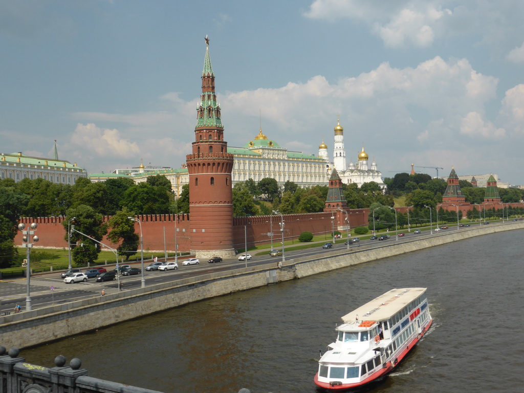 The Moscow Kremlin with the Vodovzvodnaya Tower, the Grand Kremlin Palace, the Cathedral of the Archangel Michael and the Ivan the Great Bell Tower and the Moskva river, viewed from the sightseeing bus on the Bolshoy Kamenny Bridge