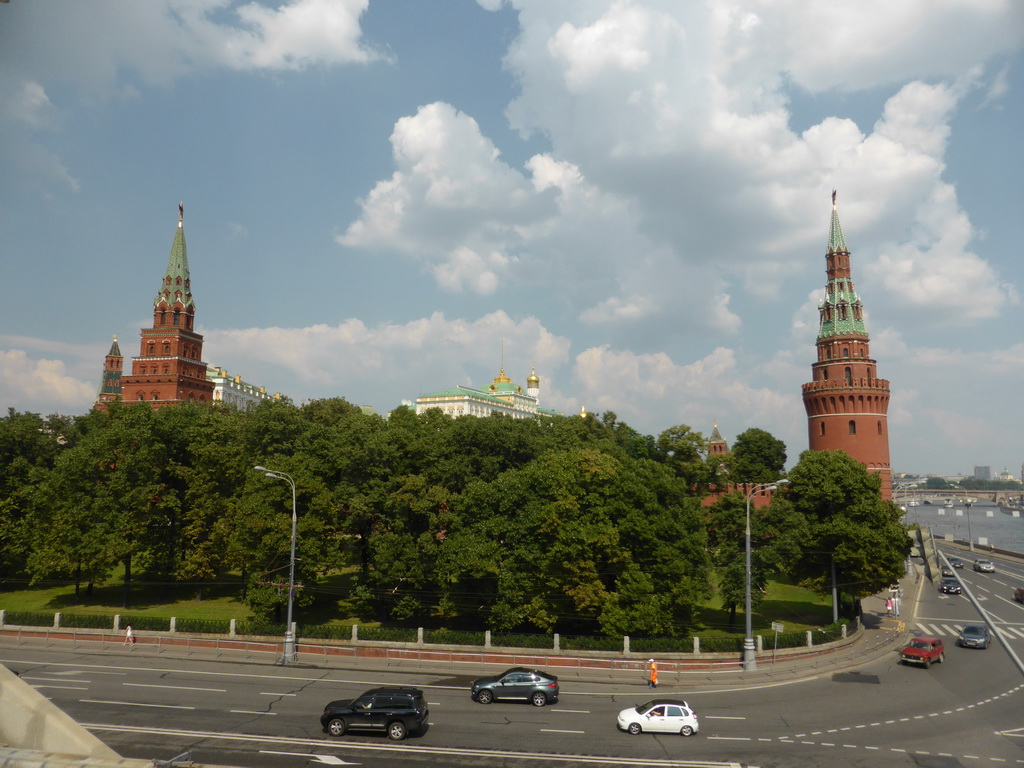 The Moscow Kremlin with the Vodovzvodnaya Tower, the Borovitskaya Tower, the Grand Kremlin Palace and the Ivan the Great Bell Tower, Borovitskaya Square and the Moskva river, viewed from the sightseeing bus on the Bolshoy Kamenny Bridge