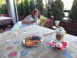 Miaomiao with cocktail, dried fruits, waterpipe and irish coffee at the Vostok Story restaurant at Yevropy Square